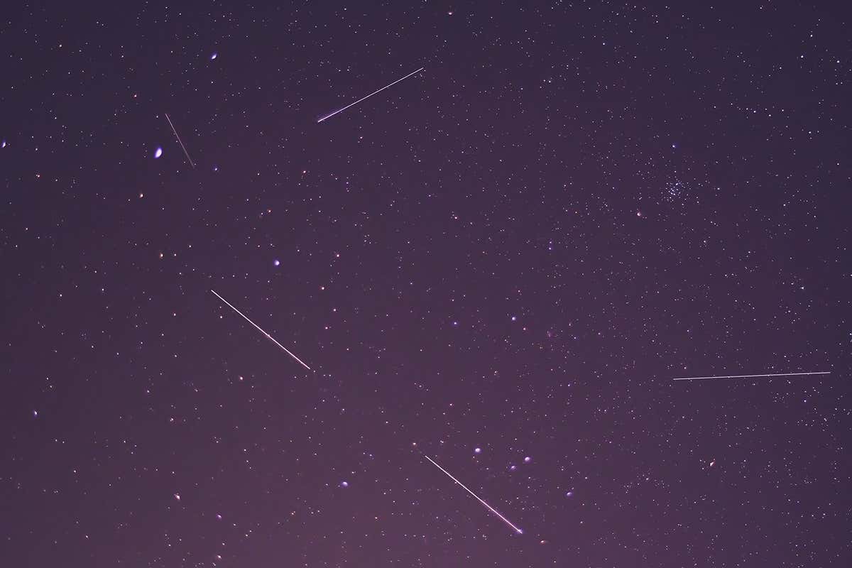 Shooting stars and Starlink stellites leaving streaks in photographs of the night sky