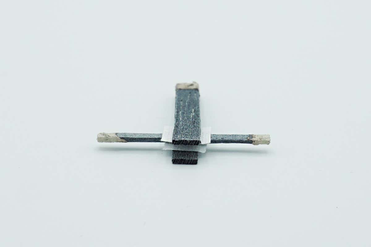 A wood transistor made from balsa wood soaked in a conductive polymer, along with carbon fibres, paraffin wax, silver paste and carbon paste.