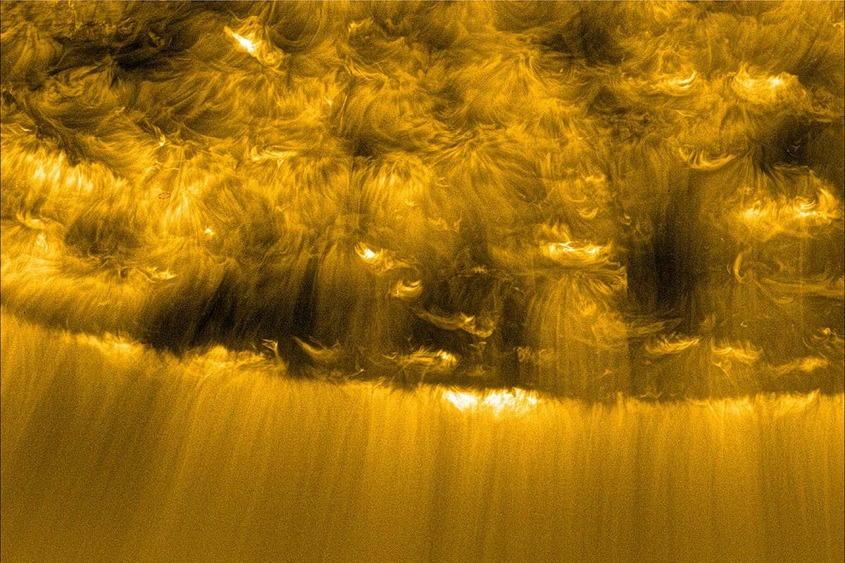 A close-up of the sun showing solar wind emerging