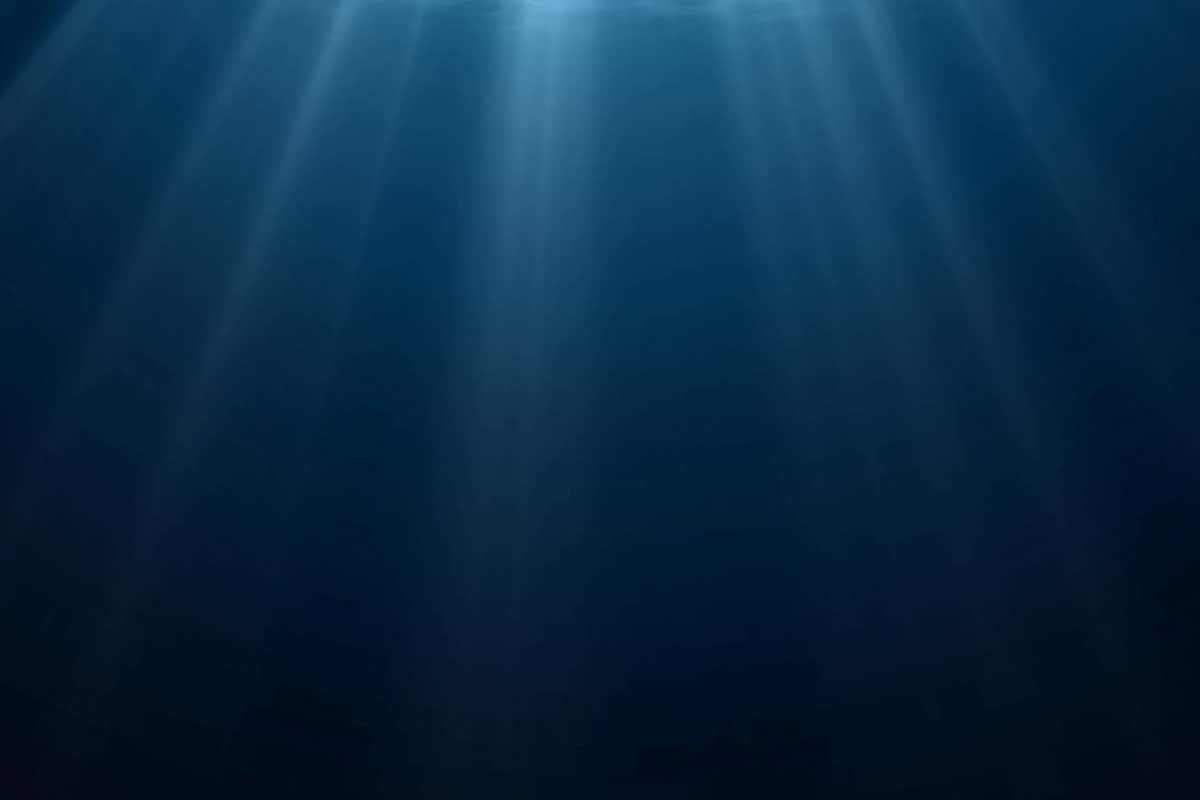 Underwater light, sun light shine under water with ripples on surface. Realistic sunlight under deep water with reflection, blue ocean or sea depth blue background; Shutterstock ID 1559777738; purchase_order: -; job: -; client: -; other: -