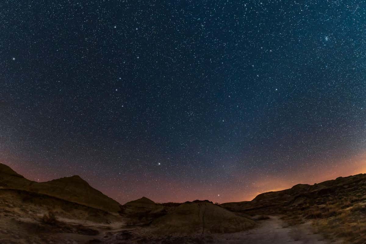 2BERRPE Spring sky panorama with Milky Way and constellations at Dinosaur Provincial Park, Canada.