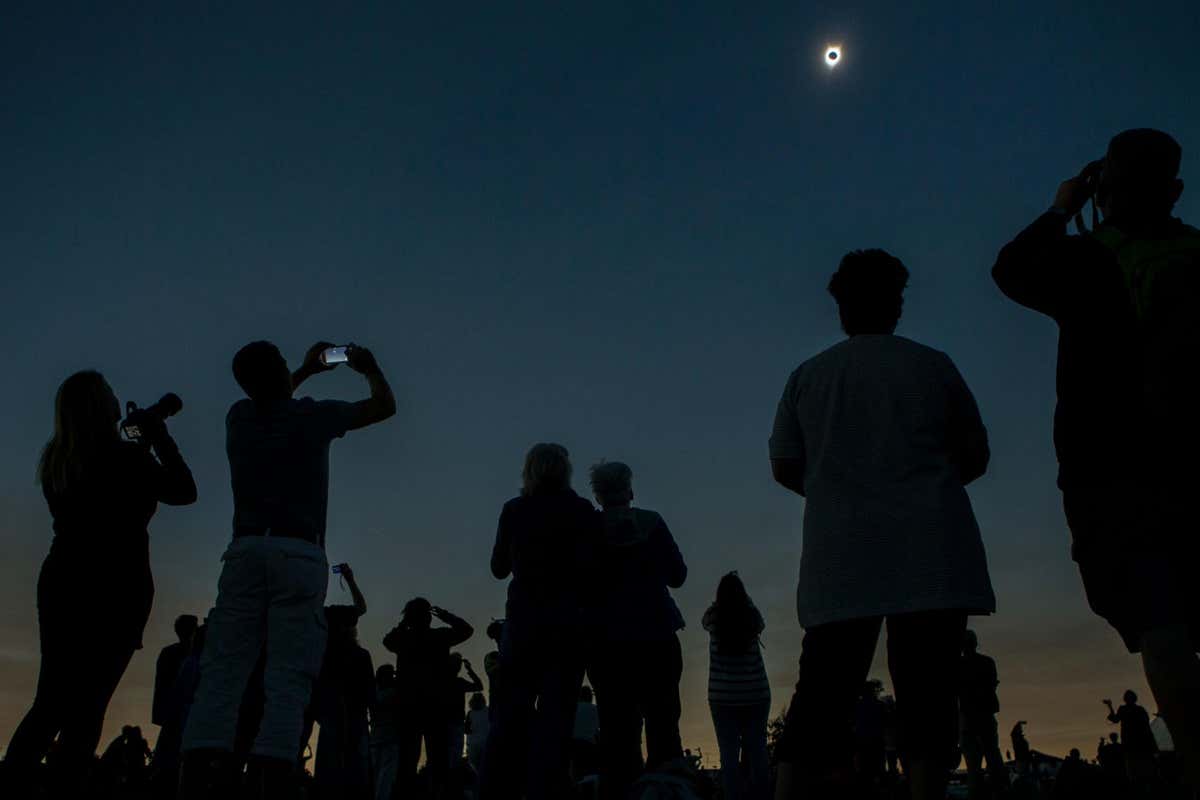 P40XX3 People watching and photographing total solar eclipse, Madras, Oregon