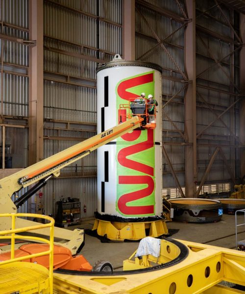 NASA workers paint iconic logo onto Artemis II rocket boosters