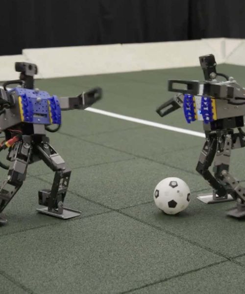 Watch mini humanoid robots showing off their football skills