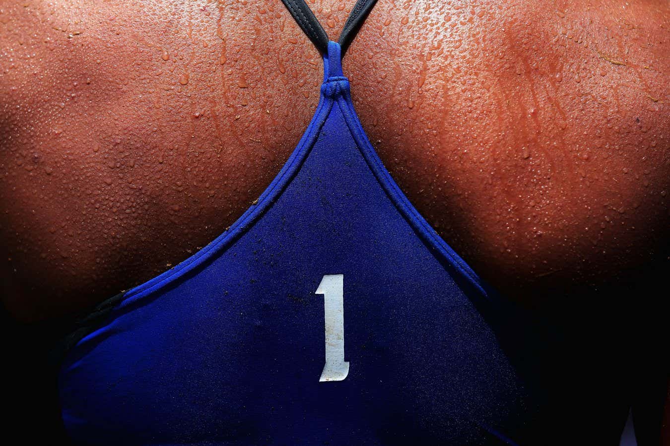 Sweat is seen on the back of Varapatsorn Radarong of Thailand during her Beach Volleyball Women's Gold Medal match at the 3rd Asian Beach Games in Haiyang, China in 2012 (Photo by Ryan Pierse/Getty Images)