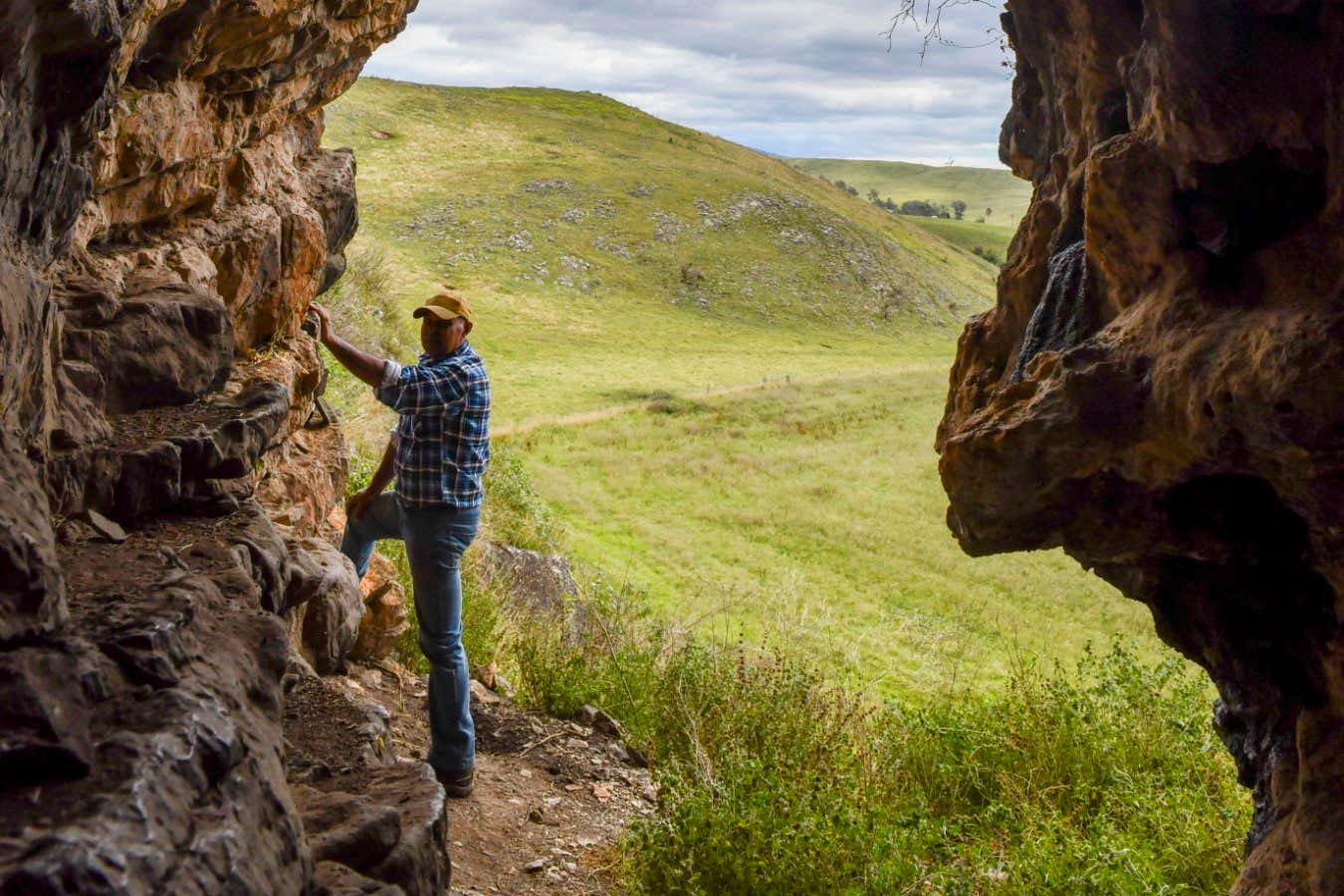 Ritual Sticks - Uncle Russell Mullett on the balcony of Cloggs Cave