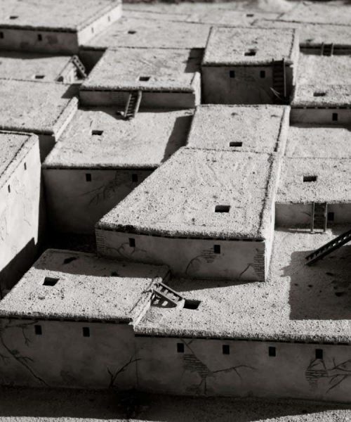 When did people start building houses with corners?