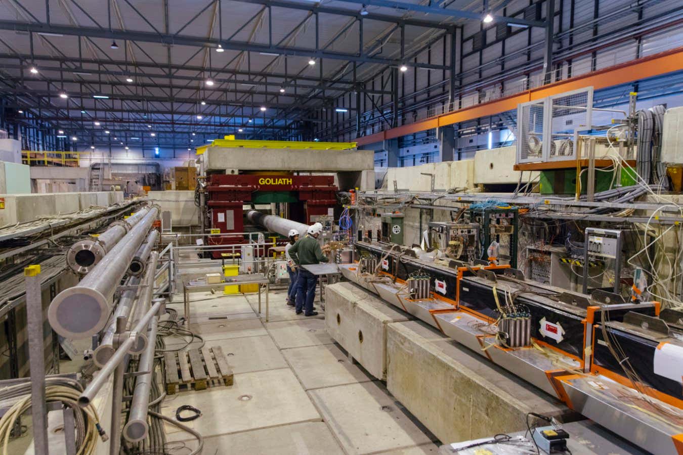 The NA 64 Experiment on the H4 beamline of CERN's SPS (Super Proton Synchrotron) and members of the collaboration.
