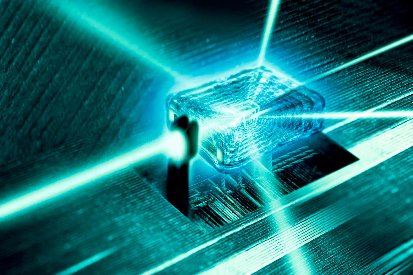 Quantum computer core. Light rays passing through the nanoscale crystal core of a quantum computer. Quantum computers, which are under development, are based on quantum mechanics and the principle of representing information in quantum bits (qubits) using quantum properties. This could involve optical properties of chemically doped crystals, like the one shown here. Quantum computing has the potential to massively increase computing power.