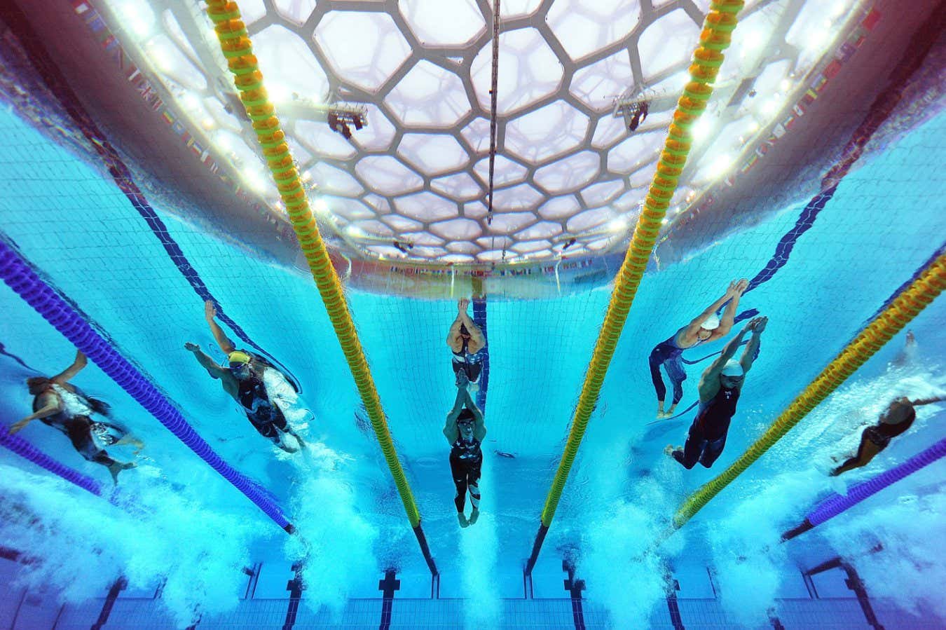 BEIJING - AUGUST 11: (L-R) Eamon Sullivan of Australia, Michael Phelps of the United States and Amaury Leveaux of France compete in the Men's 4 x 100m Freestyle Relay Final held at the National Aquatics Center on Day 3 of the Beijing 2008 Olympic Games on August 11, 2008 in Beijing, China. The United States finished the race in first place in a time of 3:08.24 and wins the gold medal and set a new World Record. Eamon Sullivan of Australia set a time of 47.24 in the first leg, a new World Record. (Photo by Adam Pretty/Getty Images)