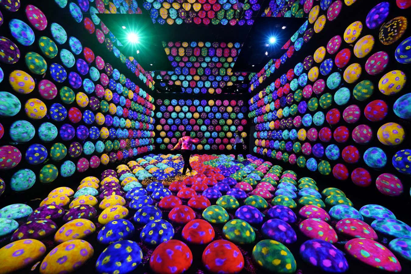 People walking through an over-stimulating art exhibit