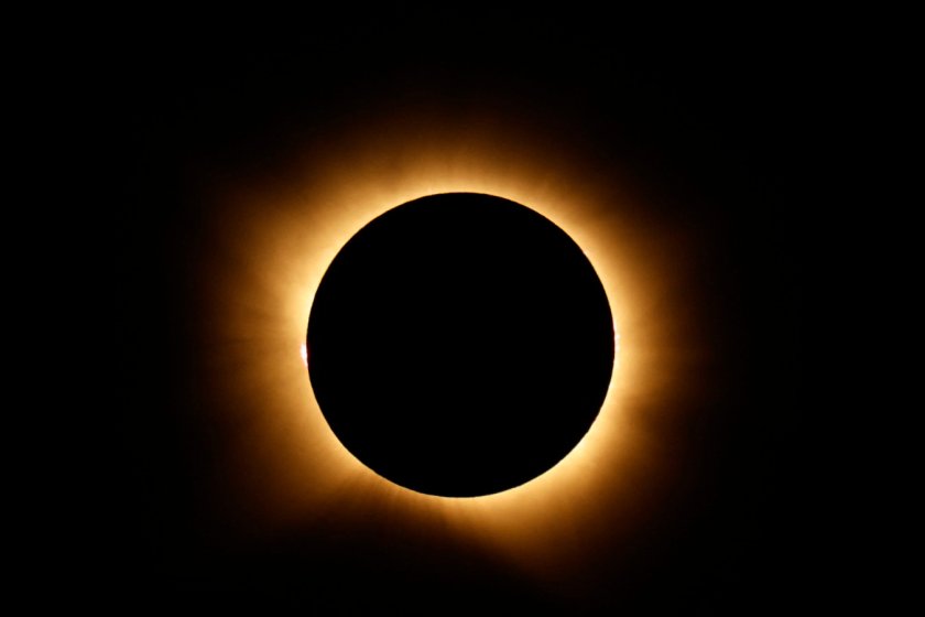 The Sun's corona glows as the Moon completely blocks the Sun during the totality phase of the total solar eclipse as seen from Berlanga de Duero, 240 km north-east of Madrid, on August 12, 2026. Millions of Europeans contemplated the sky in awe today during a rare total solar eclipse that will plunge a swathe of Spain into an eerie daytime darkness. The shadow cast when the Moon covers the Sun began in Russia's remote Arctic north at around 1700 GMT and continued in an arc through Greenland and Iceland. Spain is where most people viewed the total eclipse, which crossed the country diagonally from the northern Atlantic coast to the Mediterranean Sea, where it vanished at around 1830 GMT. (Photo by Oscar DEL POZO / AFP via Getty Images)