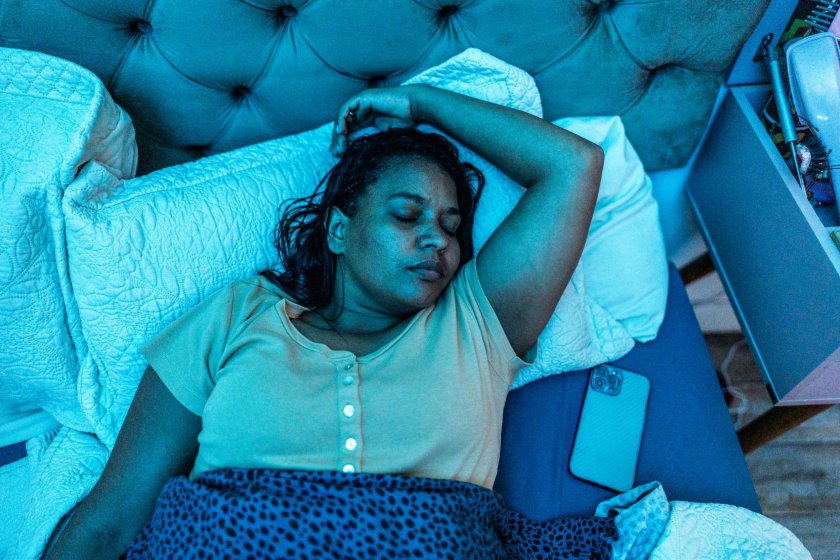 Adult woman sleeping in the bedroom at home
