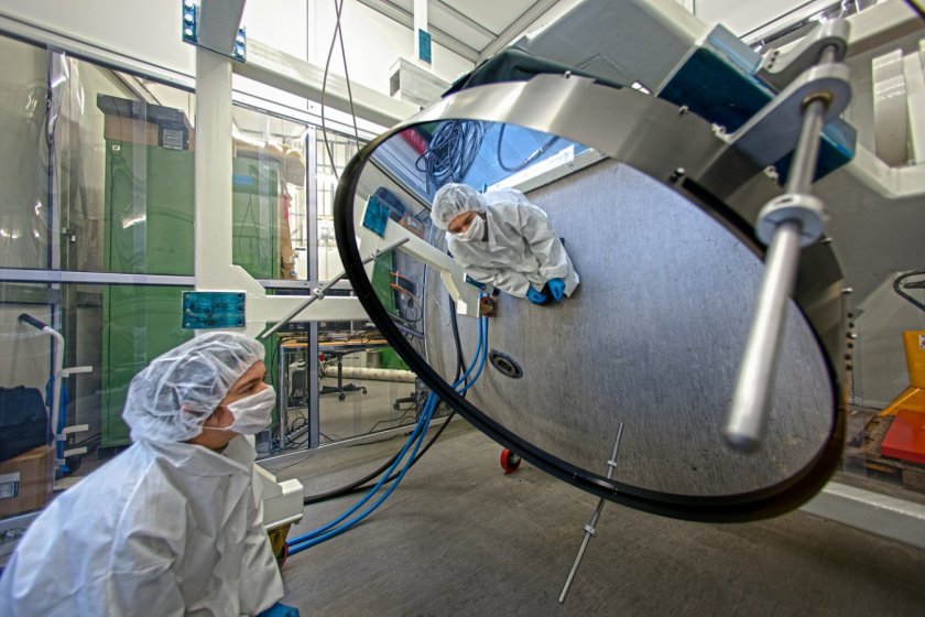 This remarkable deformable thin-shell mirror has been delivered to ESO at Garching, Germany and is shown undergoing tests. It is 1120 millimetres across but just 2 millimetres thick, making it much thinner than most glass windows. The mirror is very thin so that it is flexible enough for magnetic forces applied to it to alter the shape of its reflective surface. When in use, the mirror's surface will be constantly changed by tiny amounts to correct for the blurring effects of the Earth???s atmosphere and so create much sharper images. The new deformable secondary mirror (DSM) will replace the current secondary in one of the VLT???s four Unit Telescopes. The entire secondary structure includes a set of 1170 actuators that apply a force on 1170 magnets glued to the back face of the thin shell. Sophisticated special-purpose electronics control the behaviour of the thin shell mirror. The reflecting surface can be deformed up to a thousand times per second by the action of the actuators. The complete DSM system was delivered to ESO by the Italian companies Microgate and ADS in December 2012 and concludes eight years of sustained development efforts and manufacturing. This is the largest deformable mirror ever produced for astronomical purposes and is the latest of a long line of such mirrors. The extensive experience of these contractors shows in the high performance of the system and its reliability. The installation on the VLT is scheduled to start in 2015. The shell mirror (ann12015) itself was manufactured by the French company REOSC. It is a sheet of ceramic material that has been polished to a very accurate shape. The manufacturing process starts with a block of Zerodur ceramic, provided by Schott Glass (Germany) that is more than 70 millimetres thick. Most of this material is ground away to create the final thin shell that must be carefully supported at all times as it is extremely fragile. Links The Adaptive Optics Department at ESO Booklet on the Adaptive Optic