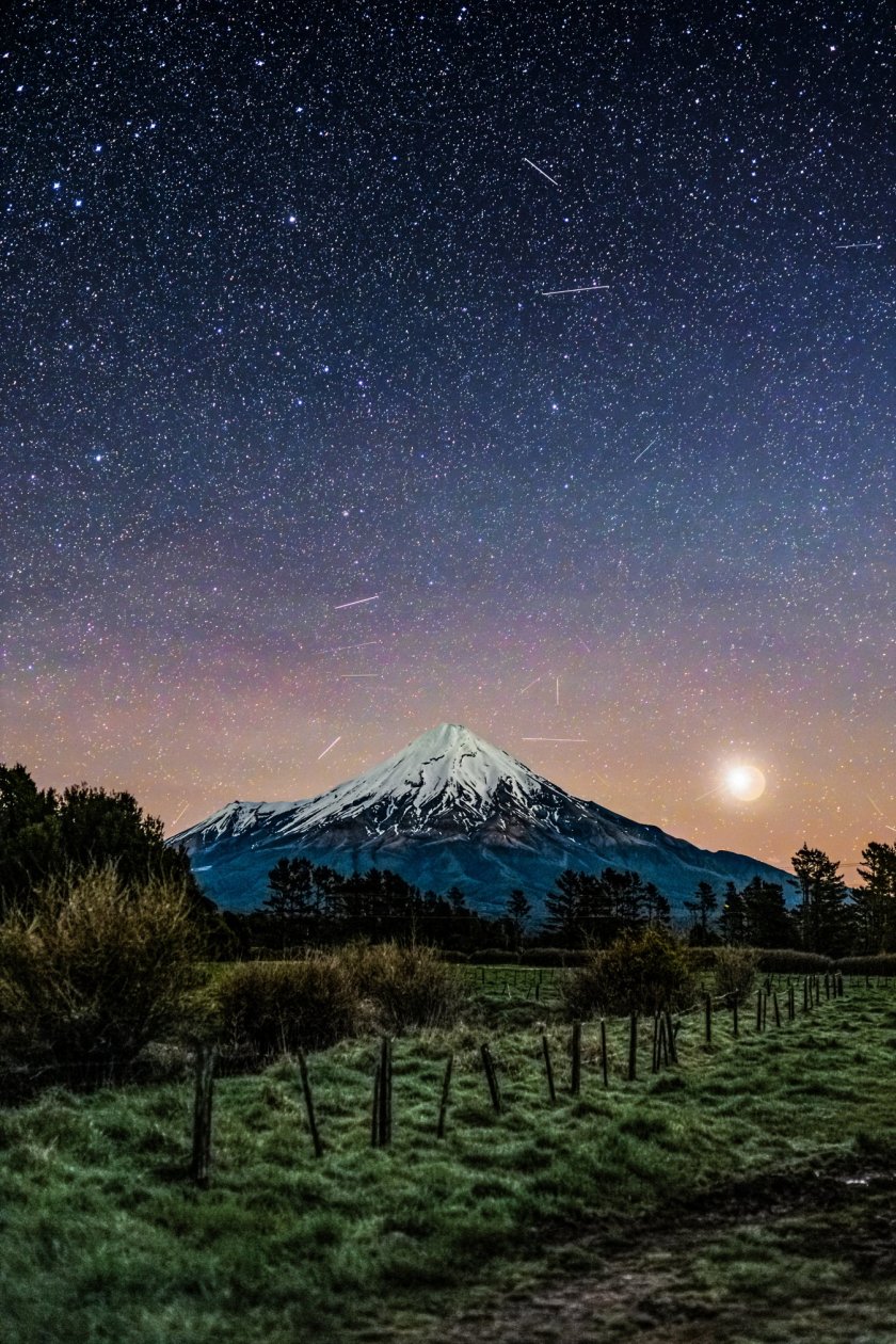 14K SATELLITE TRAILS! ? (NOT AI!) This is the most time-consuming photo edit I've EVER done! I left my camera photographing the night sky over Mt Taranaki for nearly TWO HOURS, capturing 578 photographs. The result? An estimated 14,450 satellite trail appearances, representing approximately 1,400 individual satellites! I manually masked in EVERY SINGLE TRAIL from the original photographs ? approximately 45 HOURS of editing to create this one image! Those tiny lights on the mountain are TWO mountaineers descending Mt Taranaki in the darkness over nearly two hours!