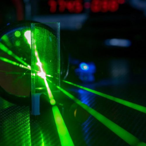Swimmer made of quantum light breaks Newton’s third law